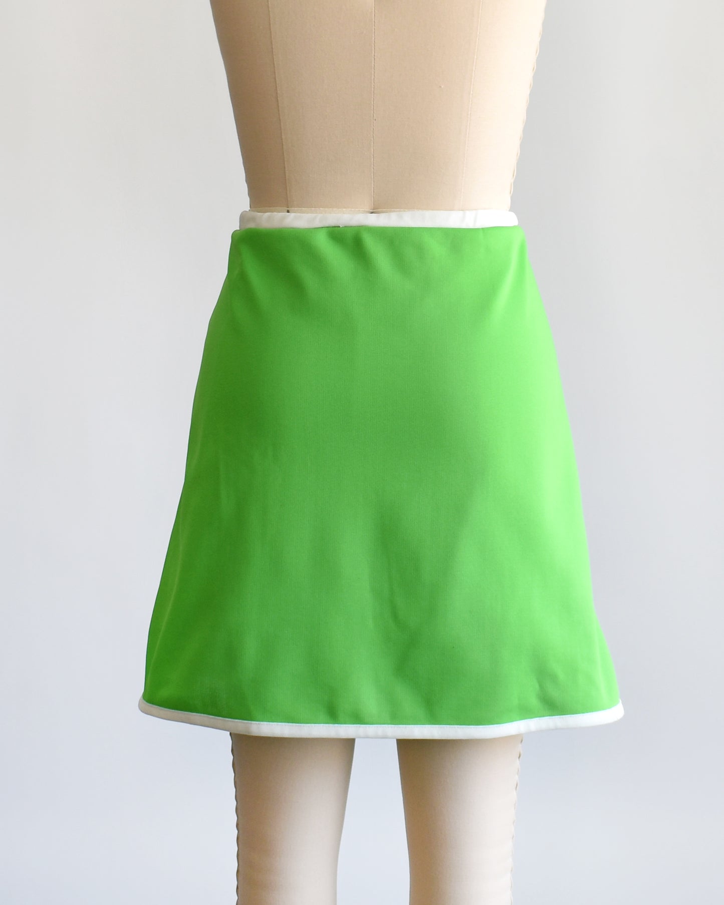 back view of a vintage 1970s green and white skort