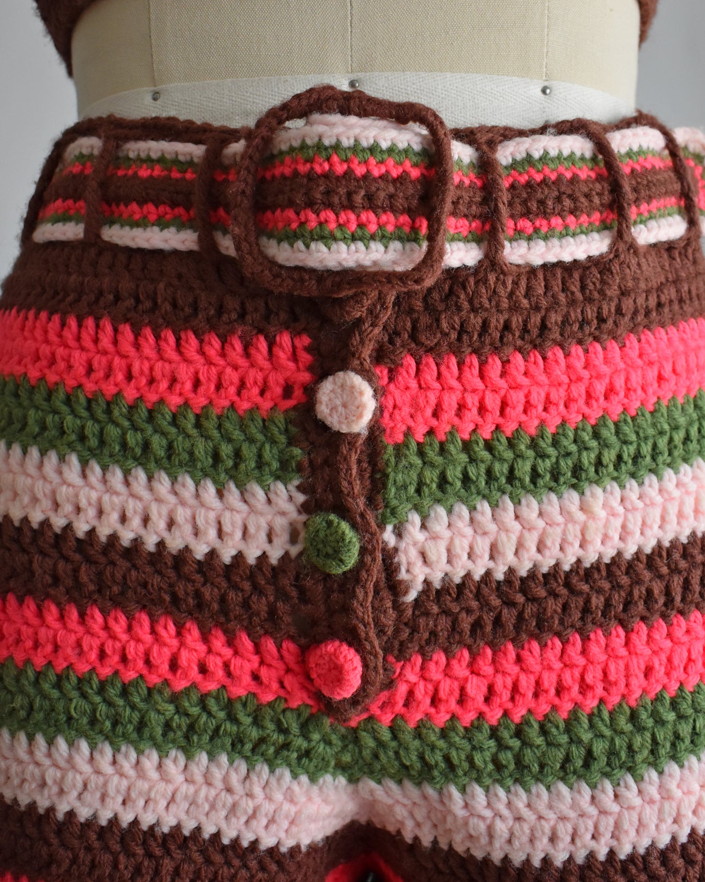 close up of the belt and the buttons on the hot pant shorts
