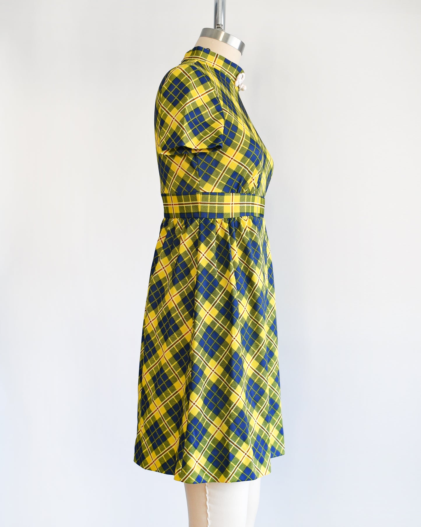 side view of a yellow and blue plaid mod mini dress