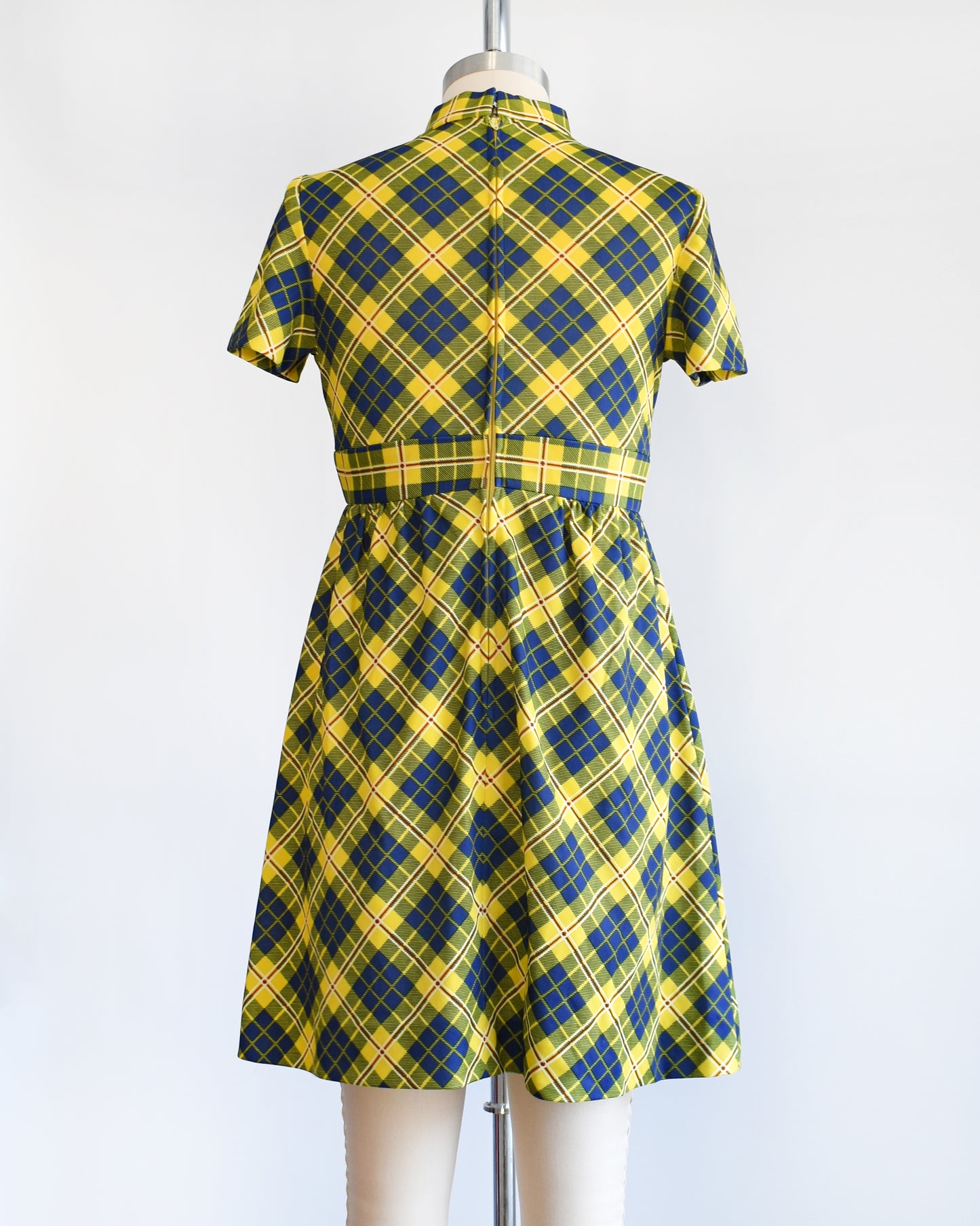 back view of a yellow and blue plaid mod mini dress