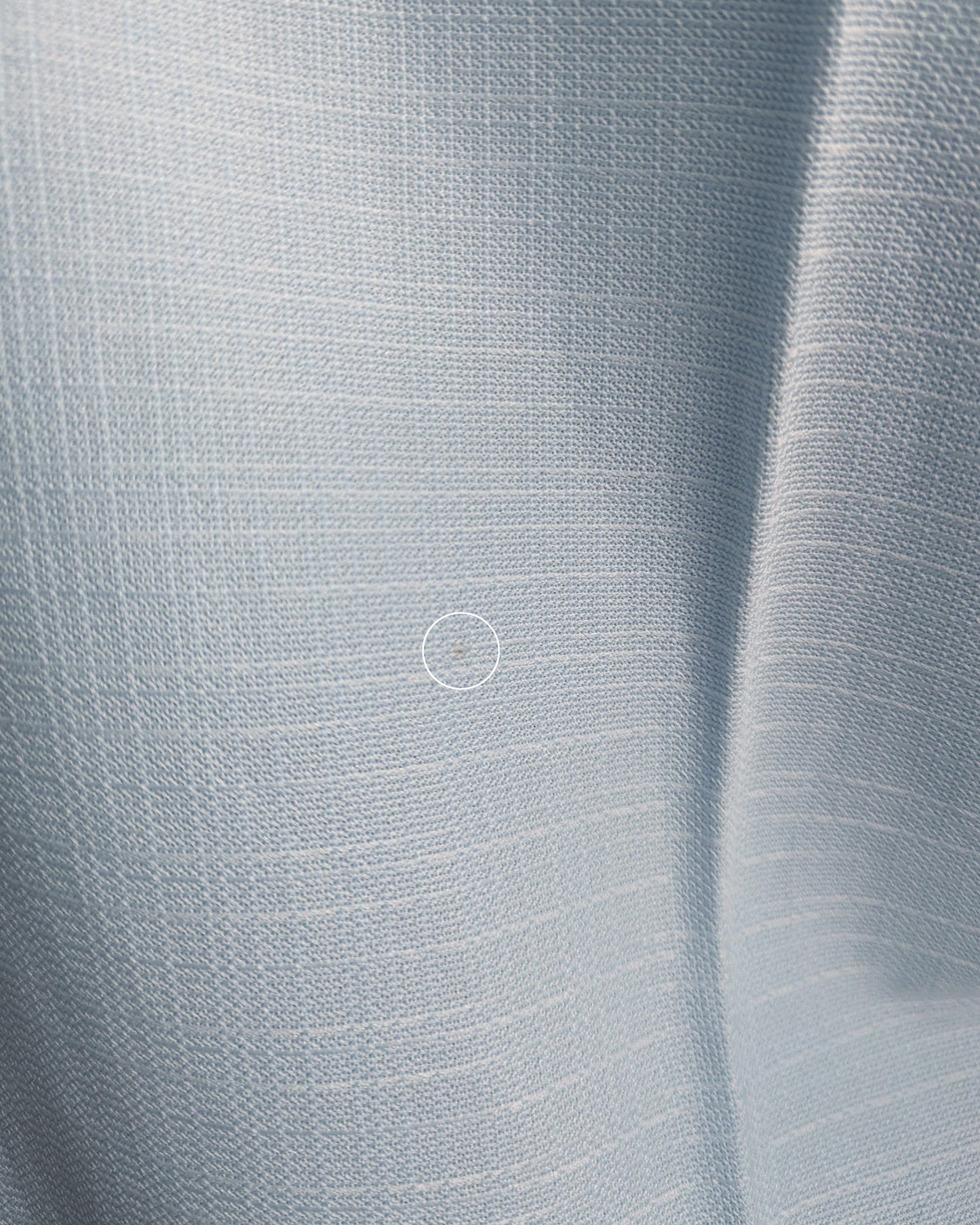a close up of the back of the pants which have a small mark that didn't come out during cleaning