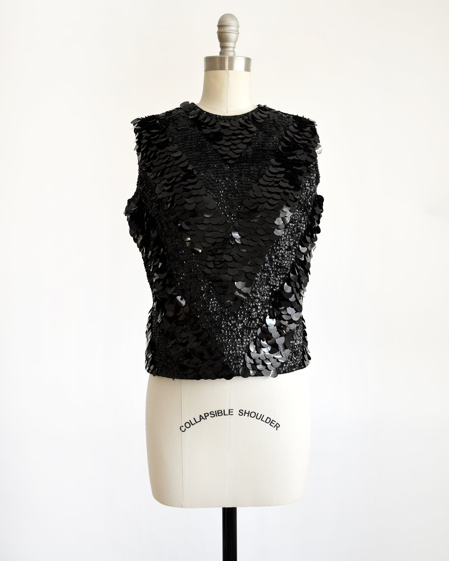 a vintage 1960s black sequin wool top