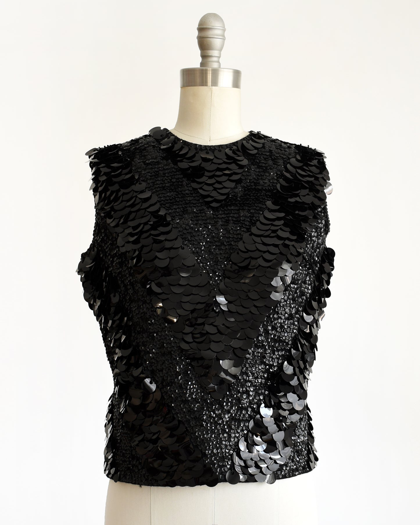 close up of a vintage 1960s black sequin wool top