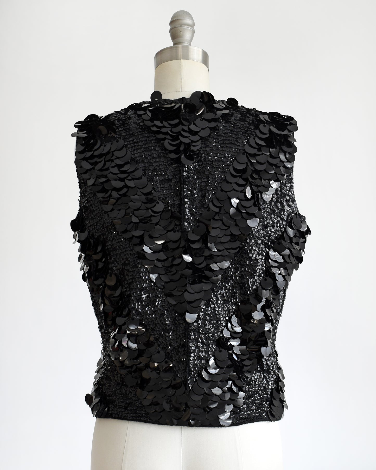 back view of a vintage 1960s black sequin wool top