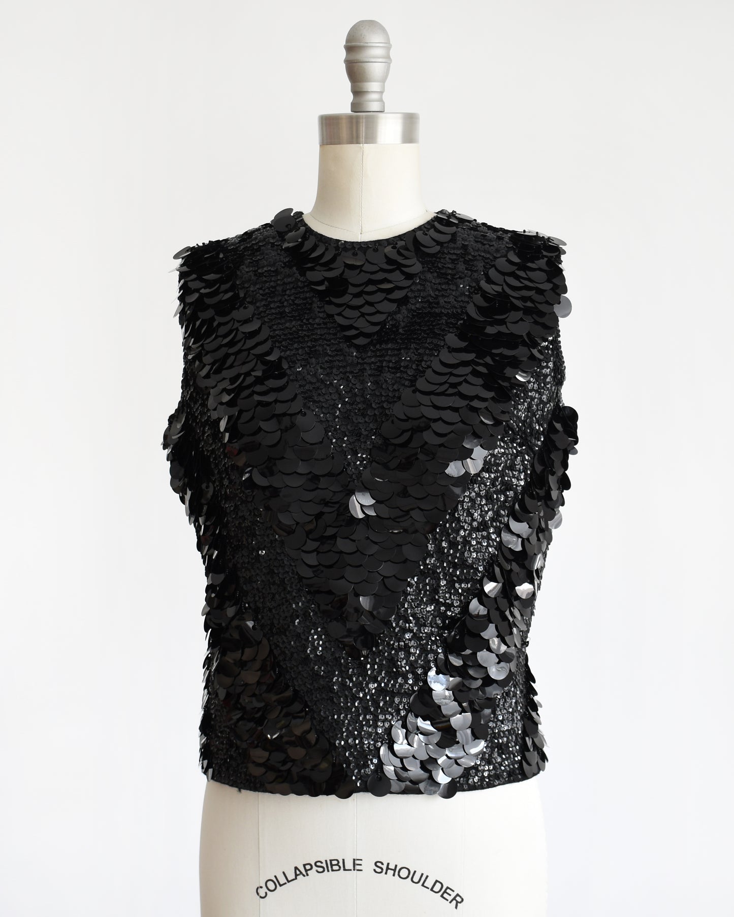 side front view of a vintage 1960s black sequin wool top