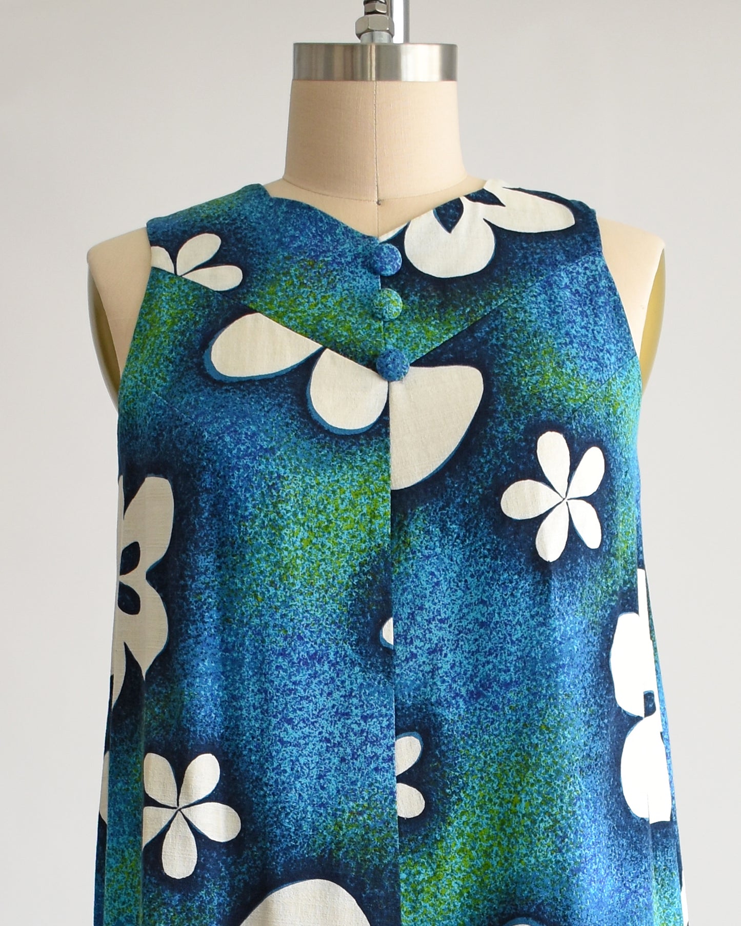 close up of the vneckline and decorative buttons