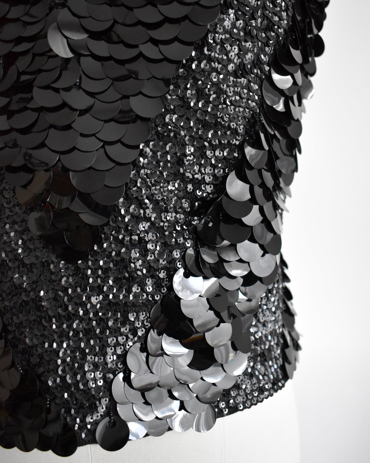 close up of the a vintage 1960s black sequin wool top