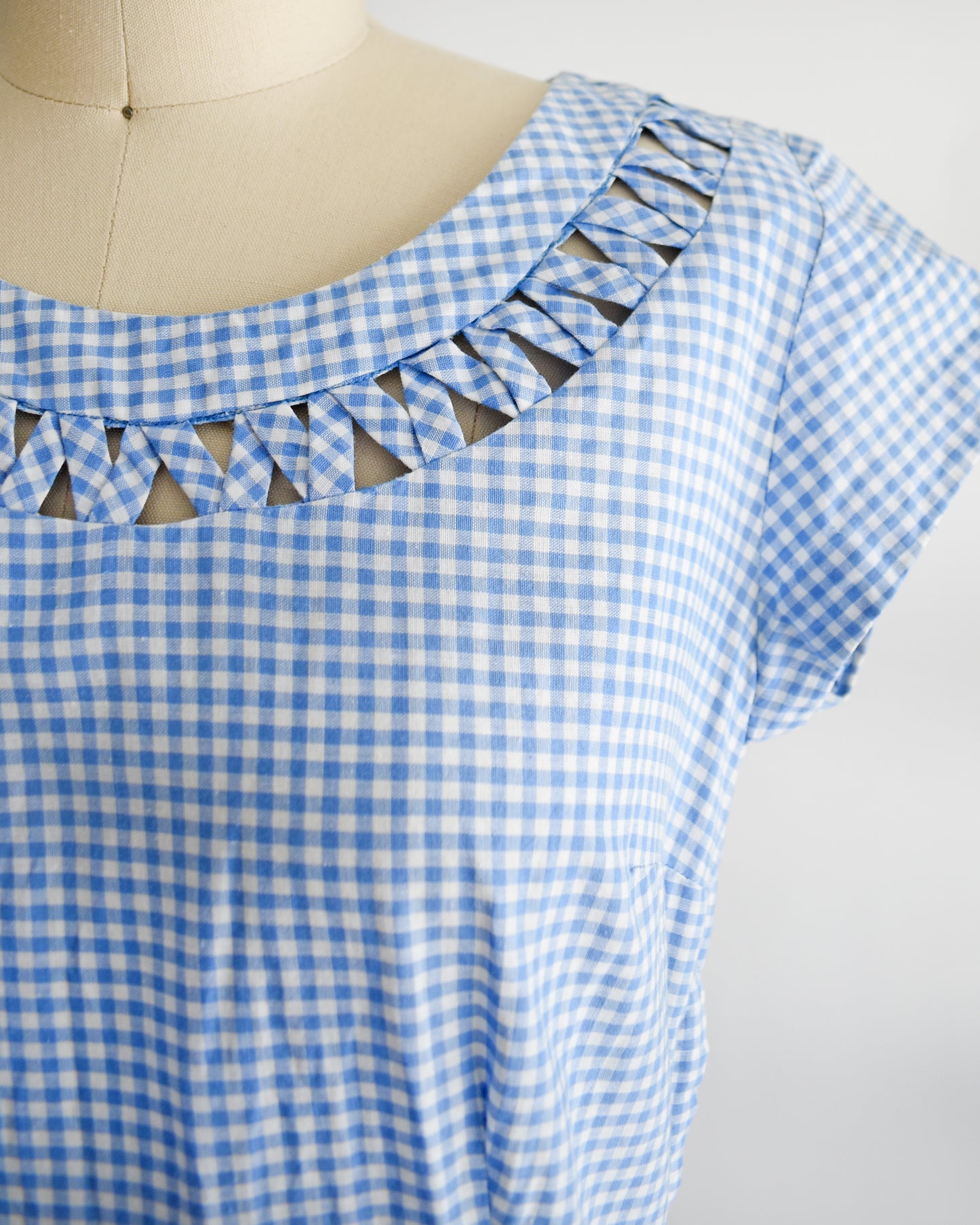 close up of the woven lattice neckline