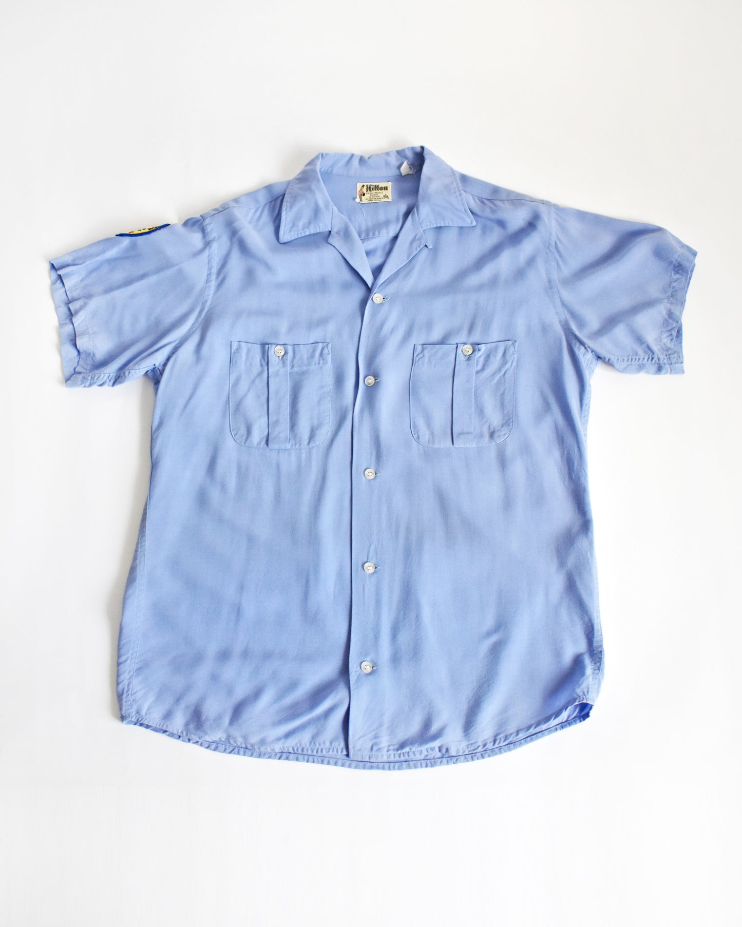 front view of a vintage 1950s/1960s Hilton bowling shirt in light blue shirt