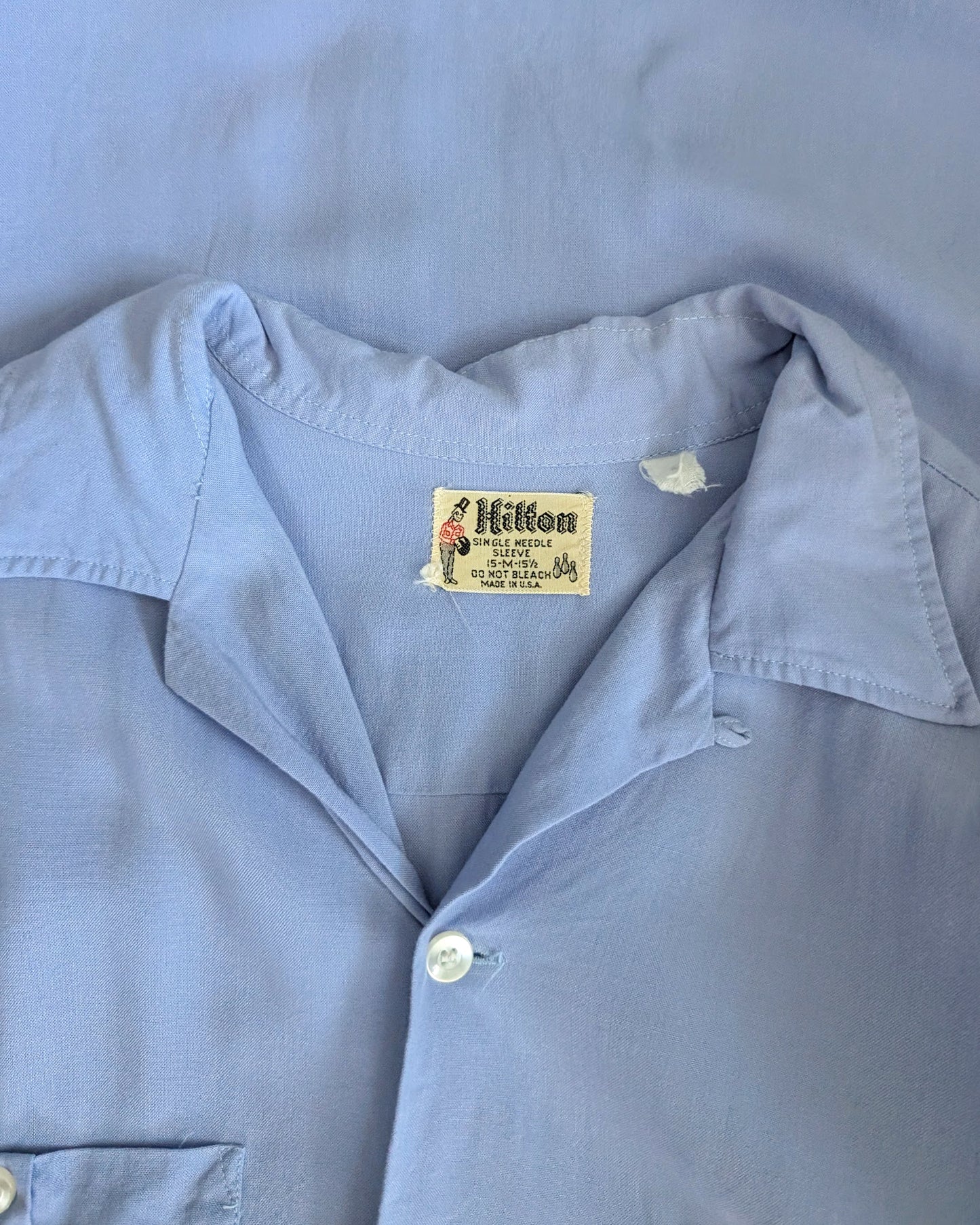 close up of the vintage Hilton tag