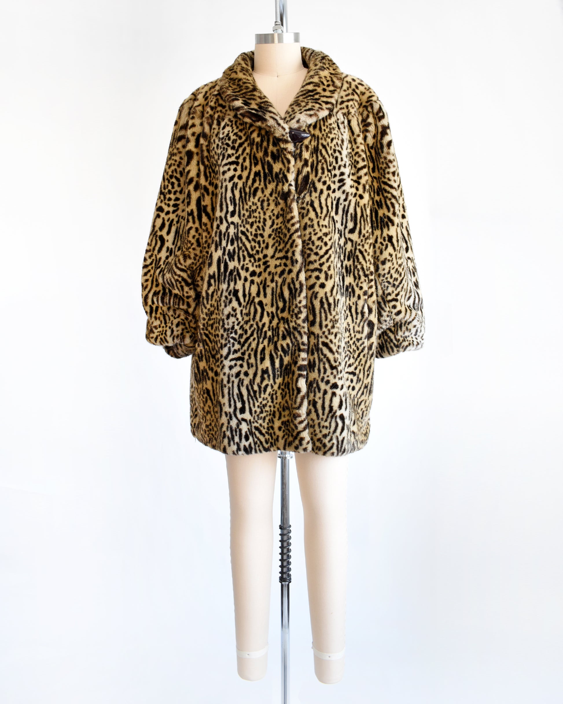 a vintage 1970s faux fur leopard print coat
