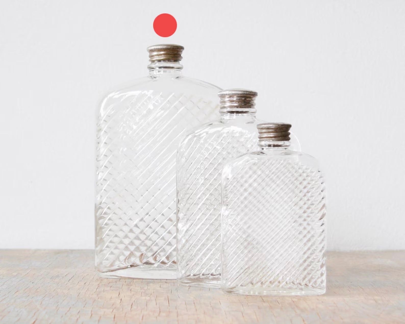 set of three glass flasks to show size