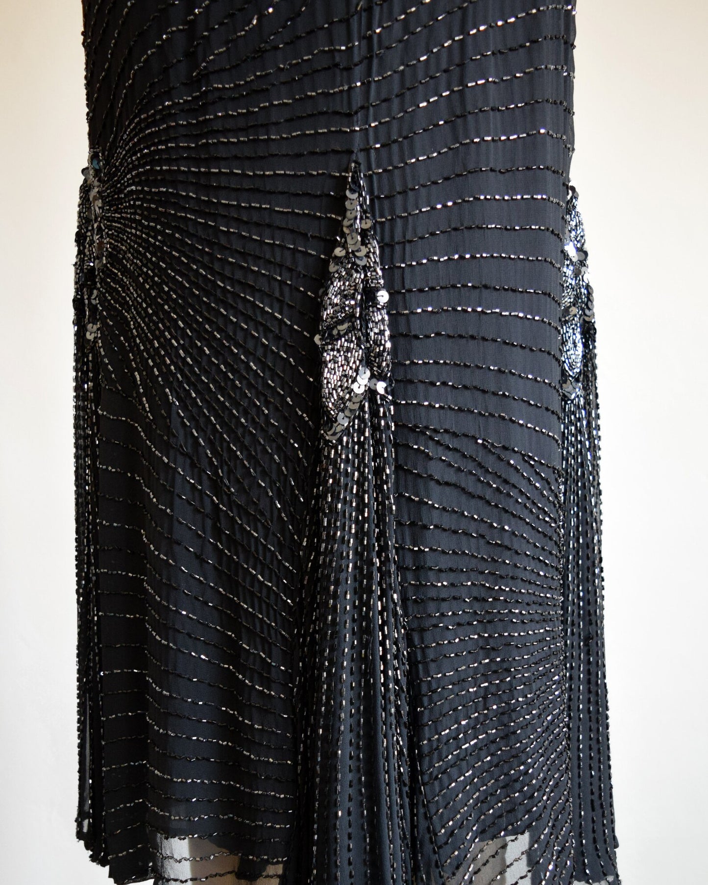 Back view of the skirt that is adorned with sequins and beads