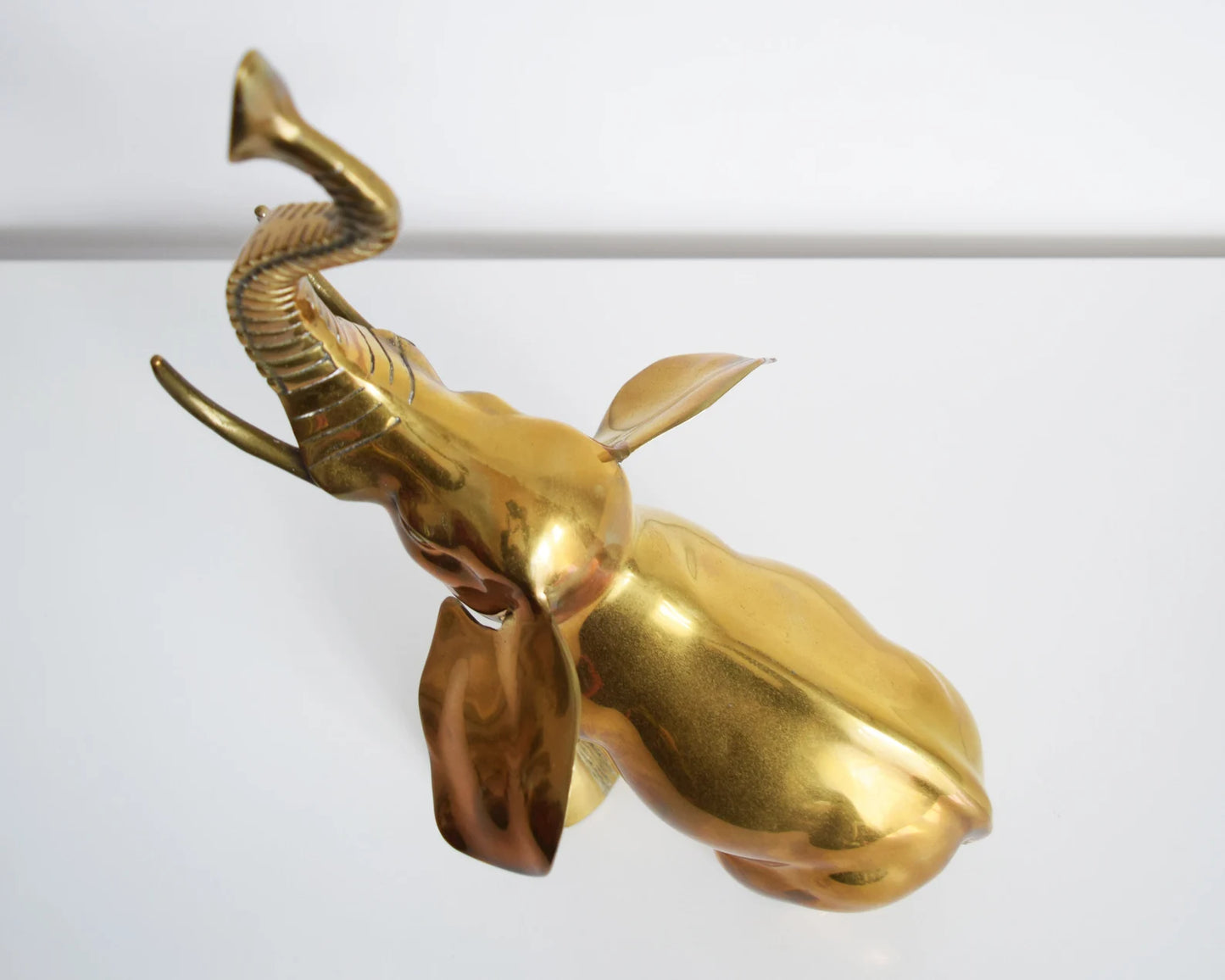 Overhead view of a large brass elephant