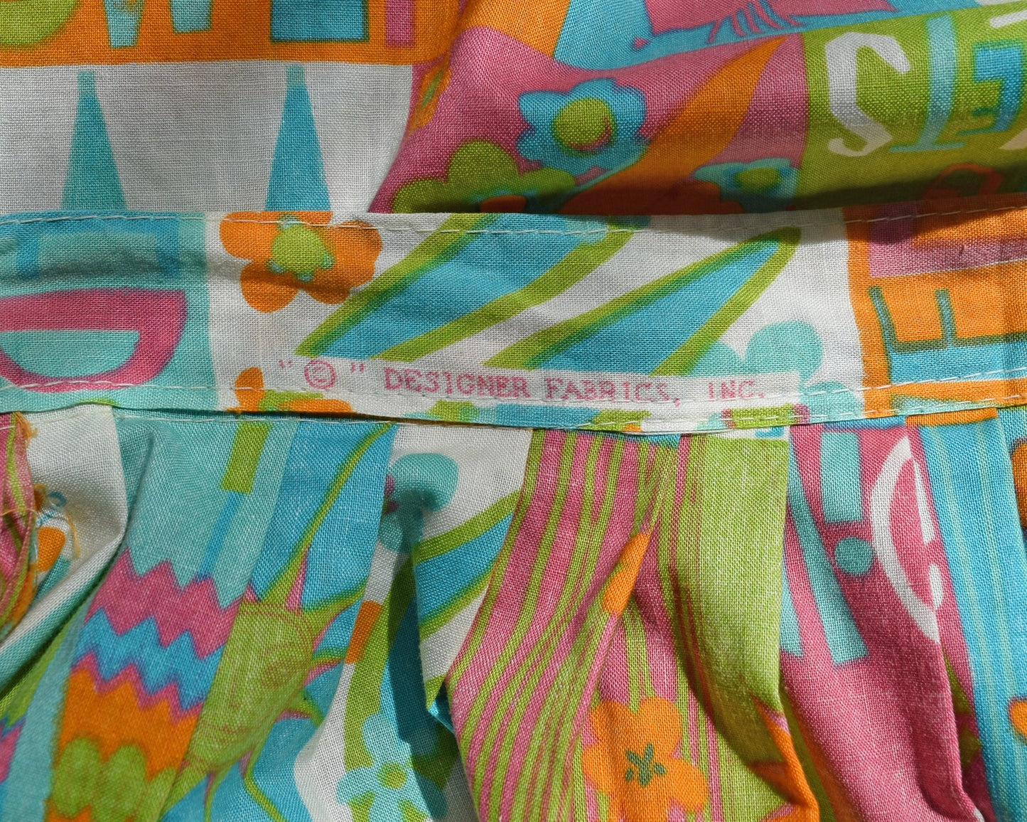 Close up of the designer fabrics, inc name