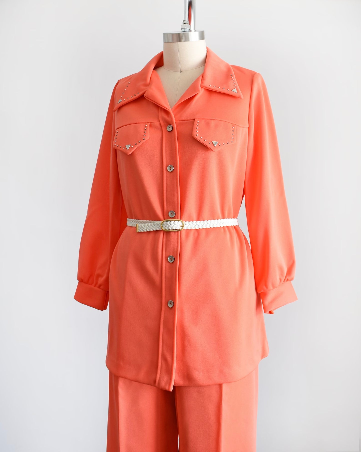closer side view of top and pants with belt
