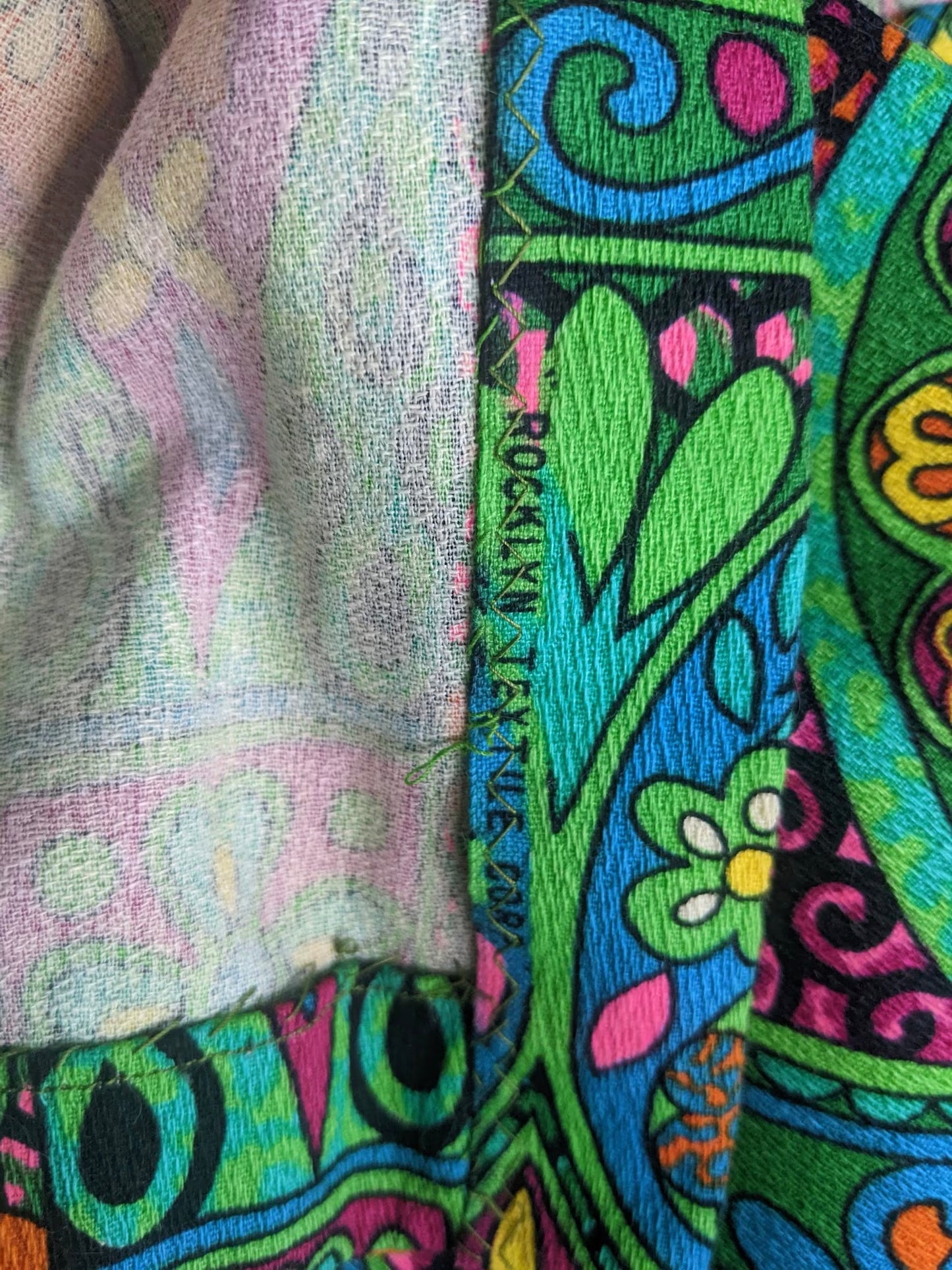 close up of fabric which says Rocklyn Textile Corp
