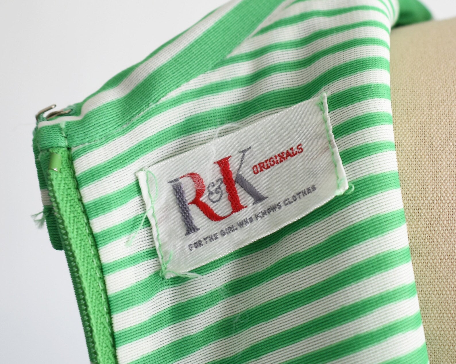 close up of tag that says R&K Originals for the girl who knows clothes 