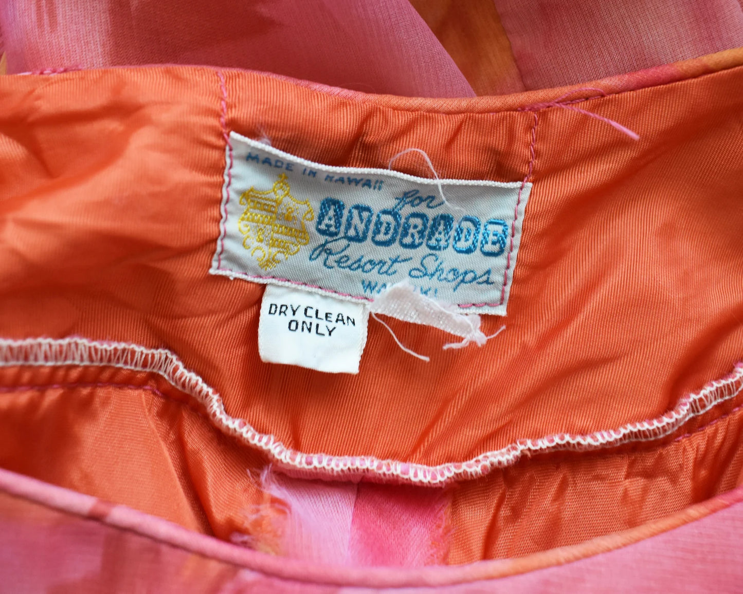 Close up of the tag that says Made in Hawaii for Andrade Resort Shops Waikiki