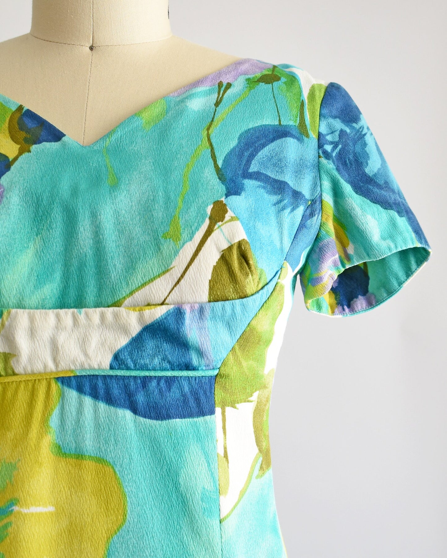 Close up of the dress which shows off the print and empire waist.