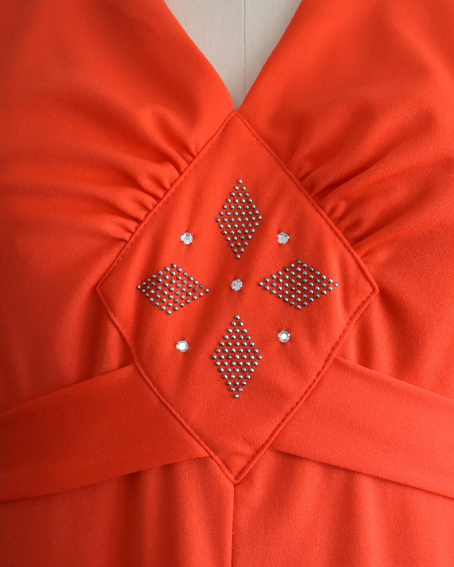 Close up of the studded and rhinestone bodice