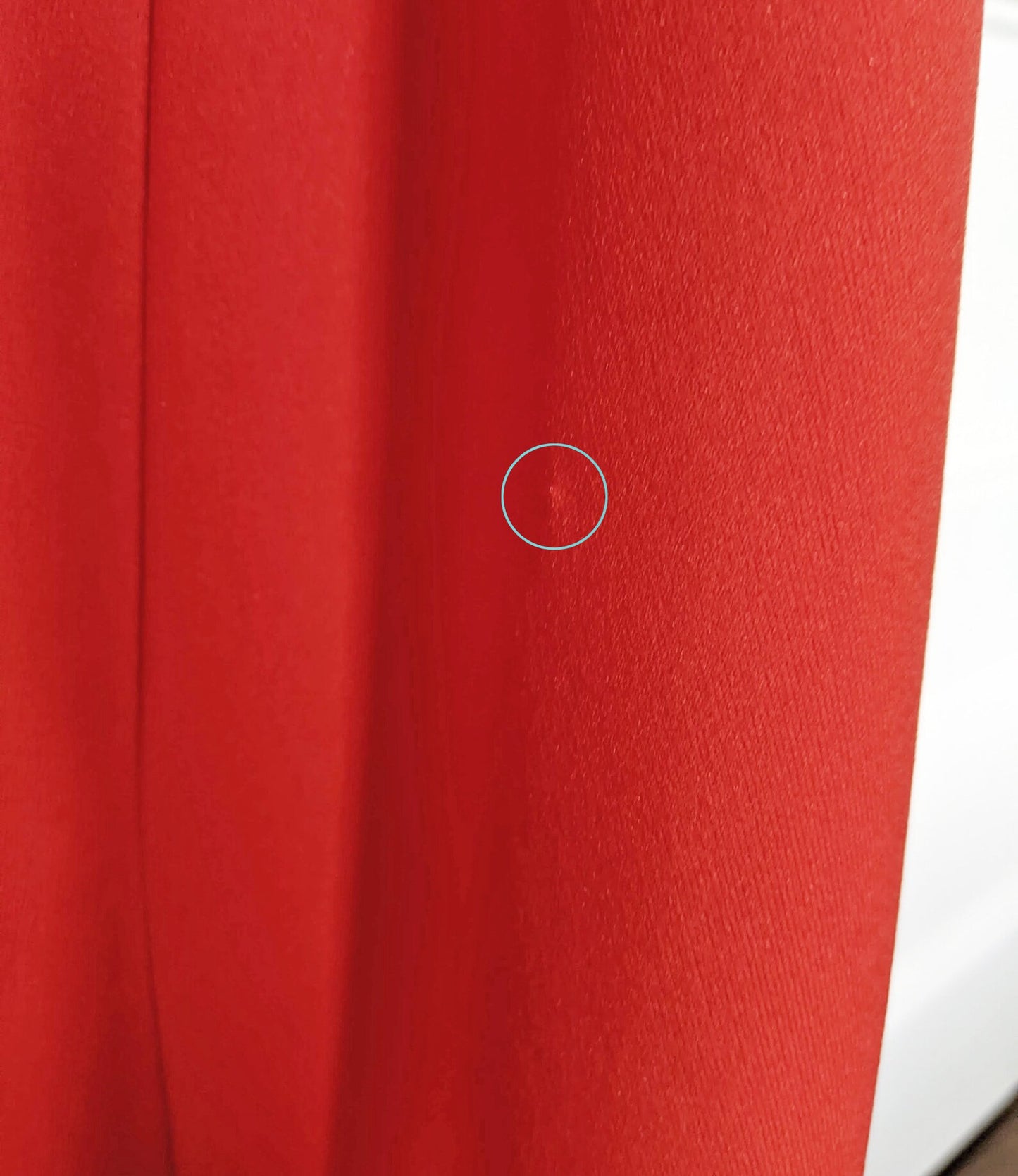 Close up of a small pull on the back left side of the dress