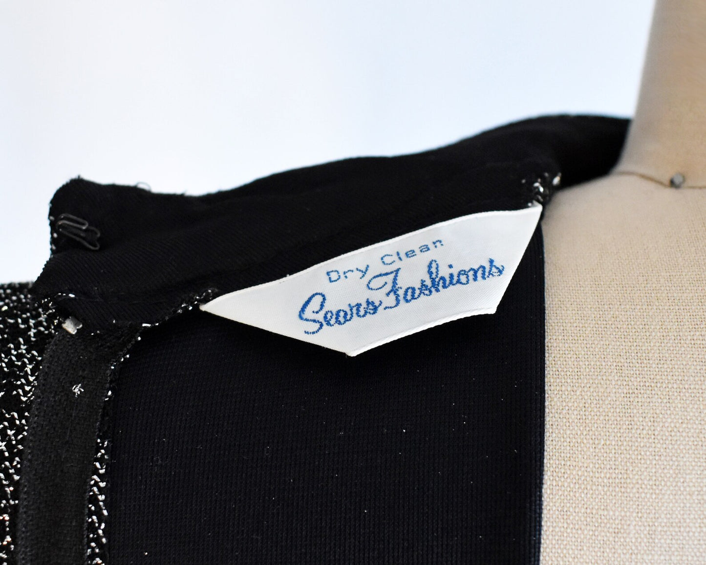 Close up of the tag that says Dry Clean, Sears Fashions