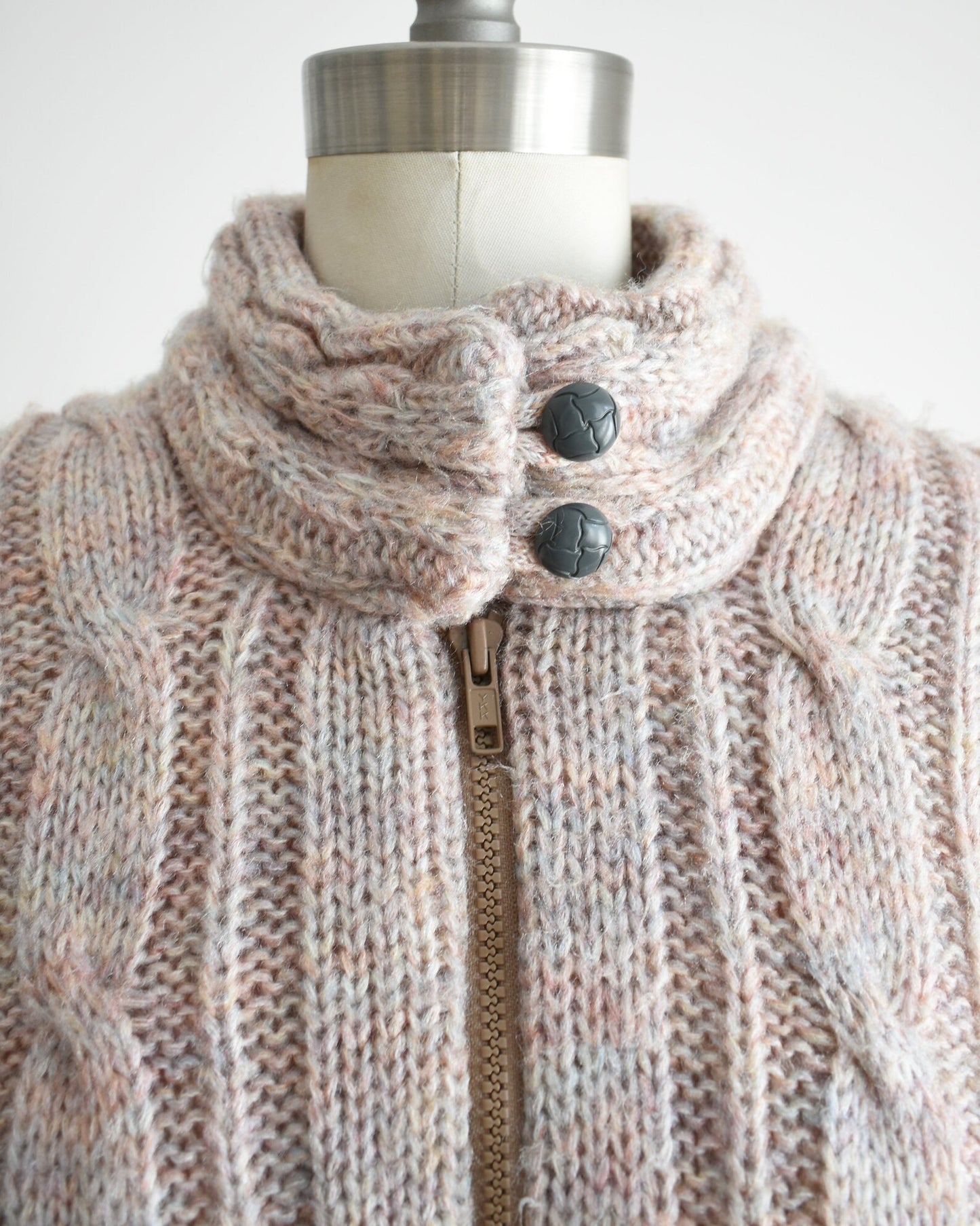 Close up of the collar which shows the two buttons and zipper down the front