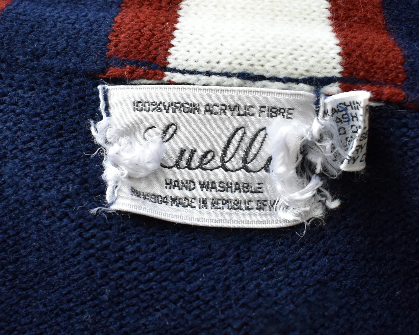 Close up of the tag which says Luella (tag is frayed)