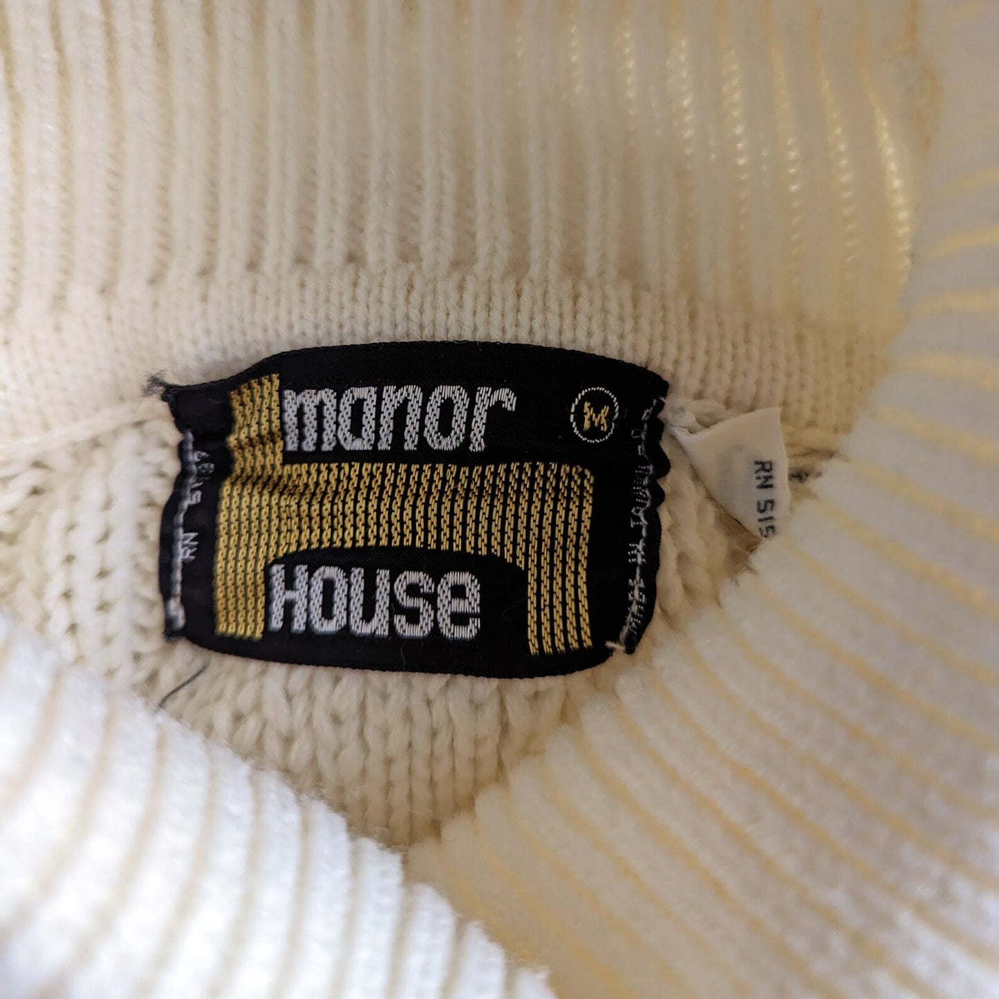 close up of the tag that says manor house