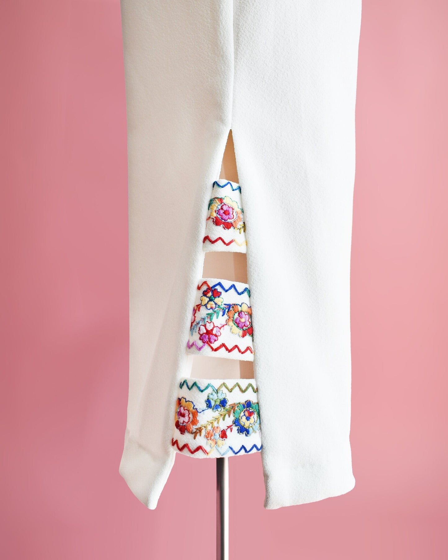Close up of the embroidered cut out detail on the side of the cuffs.