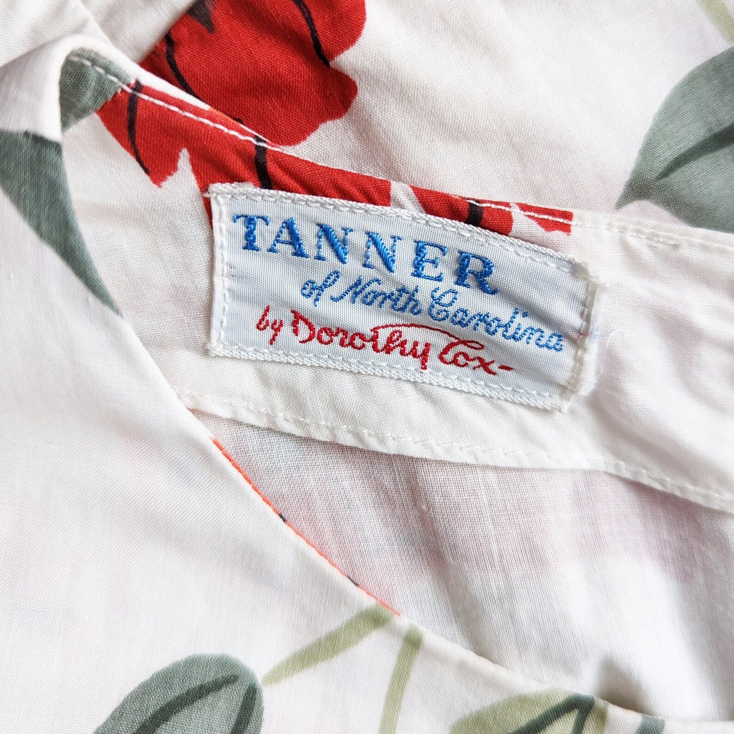 Close up of the tag that says Tanner of North Carolina by Dorothy Cox