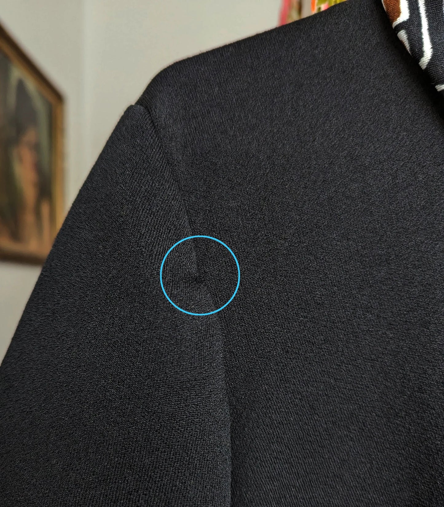 Close up of an alteration that was done to the sleeve seam by a previous owner.