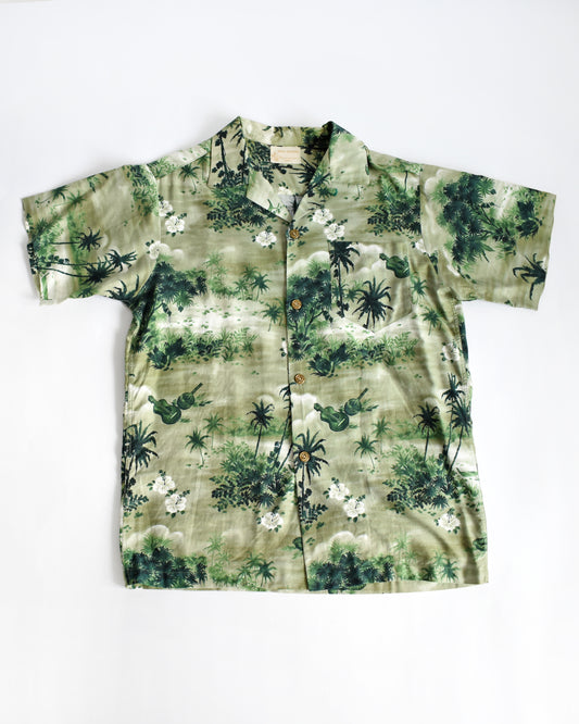 a vintage 1950s green Hawaiian shirt by Royal Hawaiian on a white background