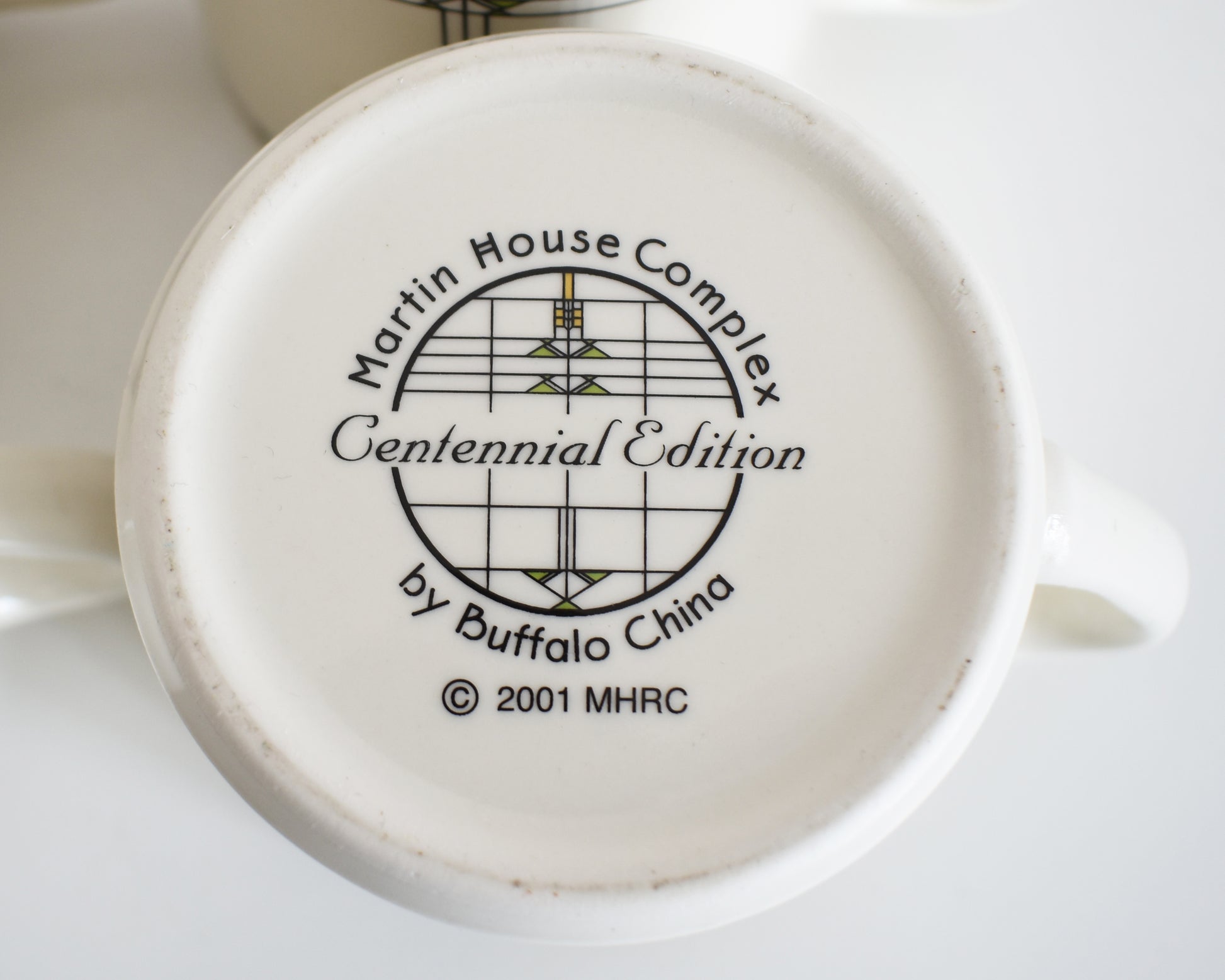 Ceramic product with 'Martin House Complex Centennial Edition by Buffalo China' branding on a white background