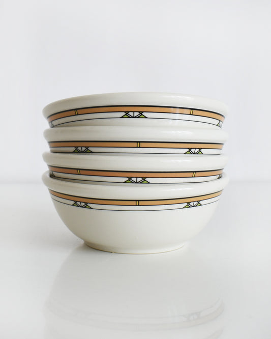a stack of Frank Lloyd Wright Martin House white bowls with brown geometric patterns on a white background