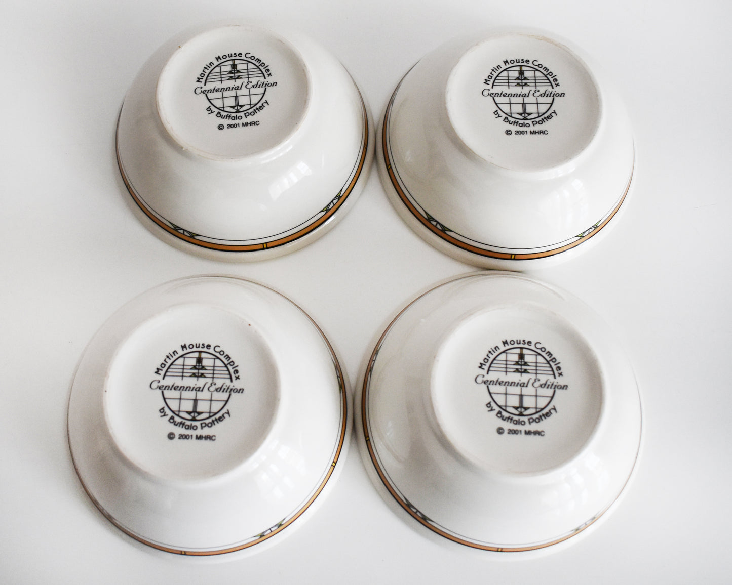 overhead shot of the bottom of the bowls that are stamped 'Martin House Complex, Centennial Edition, by Buffalo China, 2001'