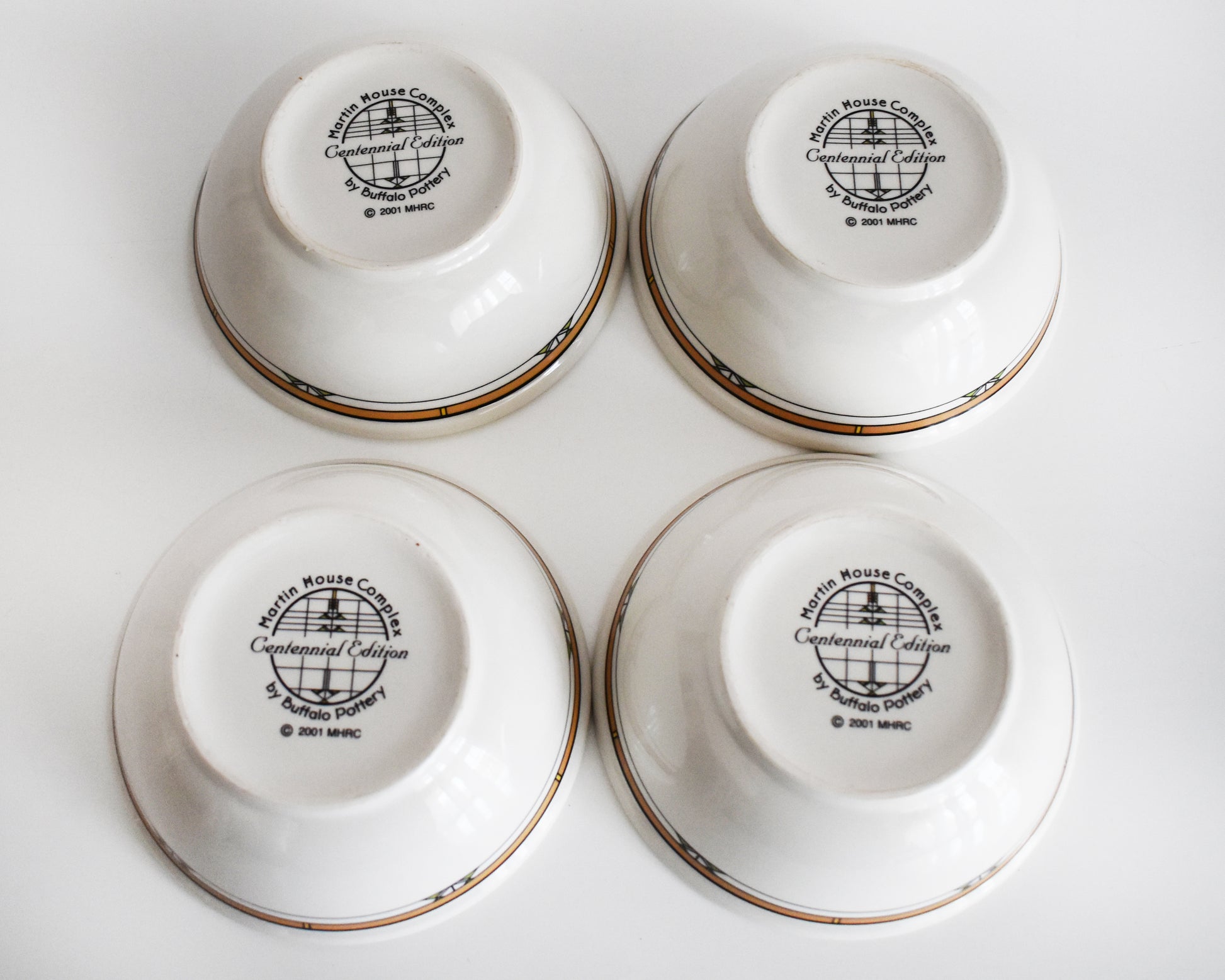 overhead shot of the bottom of the bowls that are stamped 'Martin House Complex, Centennial Edition, by Buffalo China, 2001'