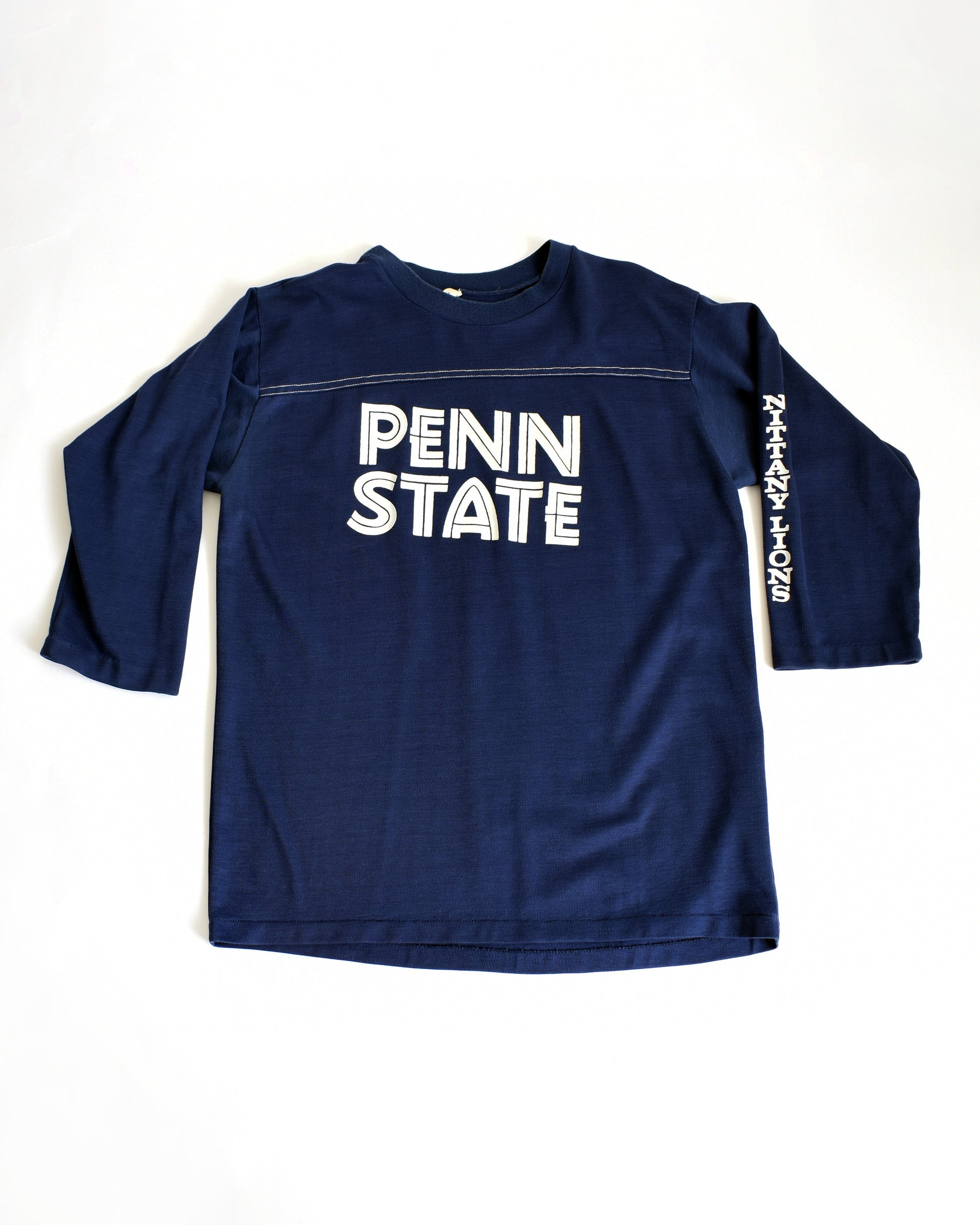 a vintage navy long-sleeve shirt with 'Penn State' text on a white background