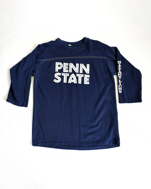 a vintage navy long-sleeve shirt with 'Penn State' text on a white background