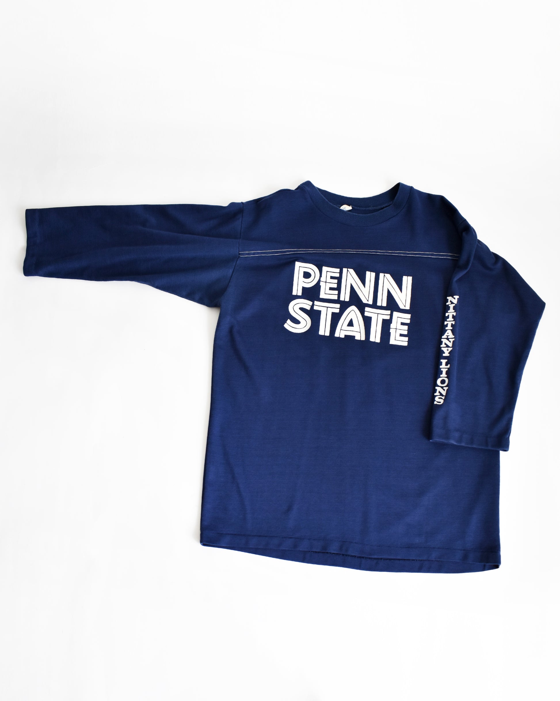 a vintage navy long-sleeve shirt with 'Penn State' text on a white background