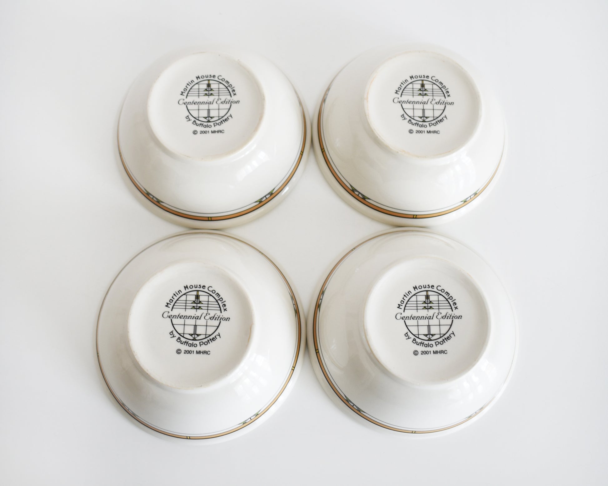 overhead shot of the bottom of the bowls that are stamped 'Martin House Complex, Centennial Edition, by Buffalo China, 2001'