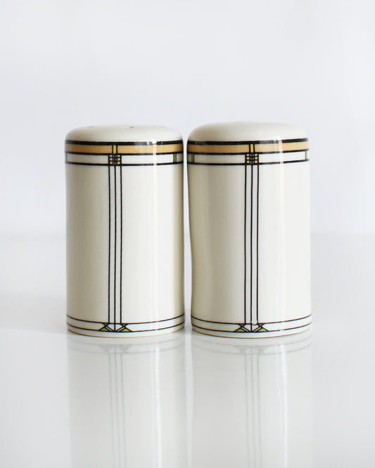 a set of ceramic Frank Lloyd Wright Martin House salt and pepper shakers on a white background