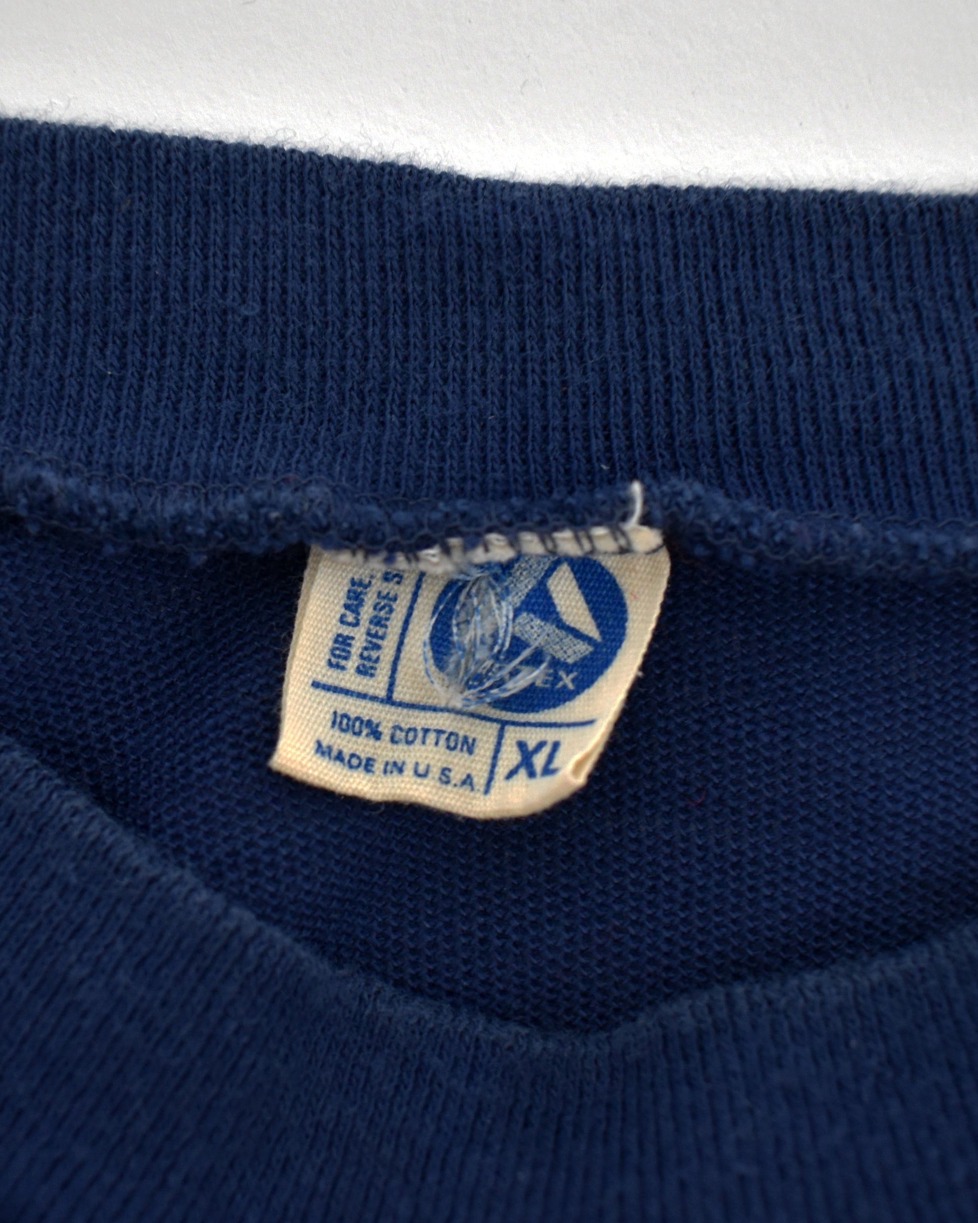close up of the tag which says Artex and 100% cotton