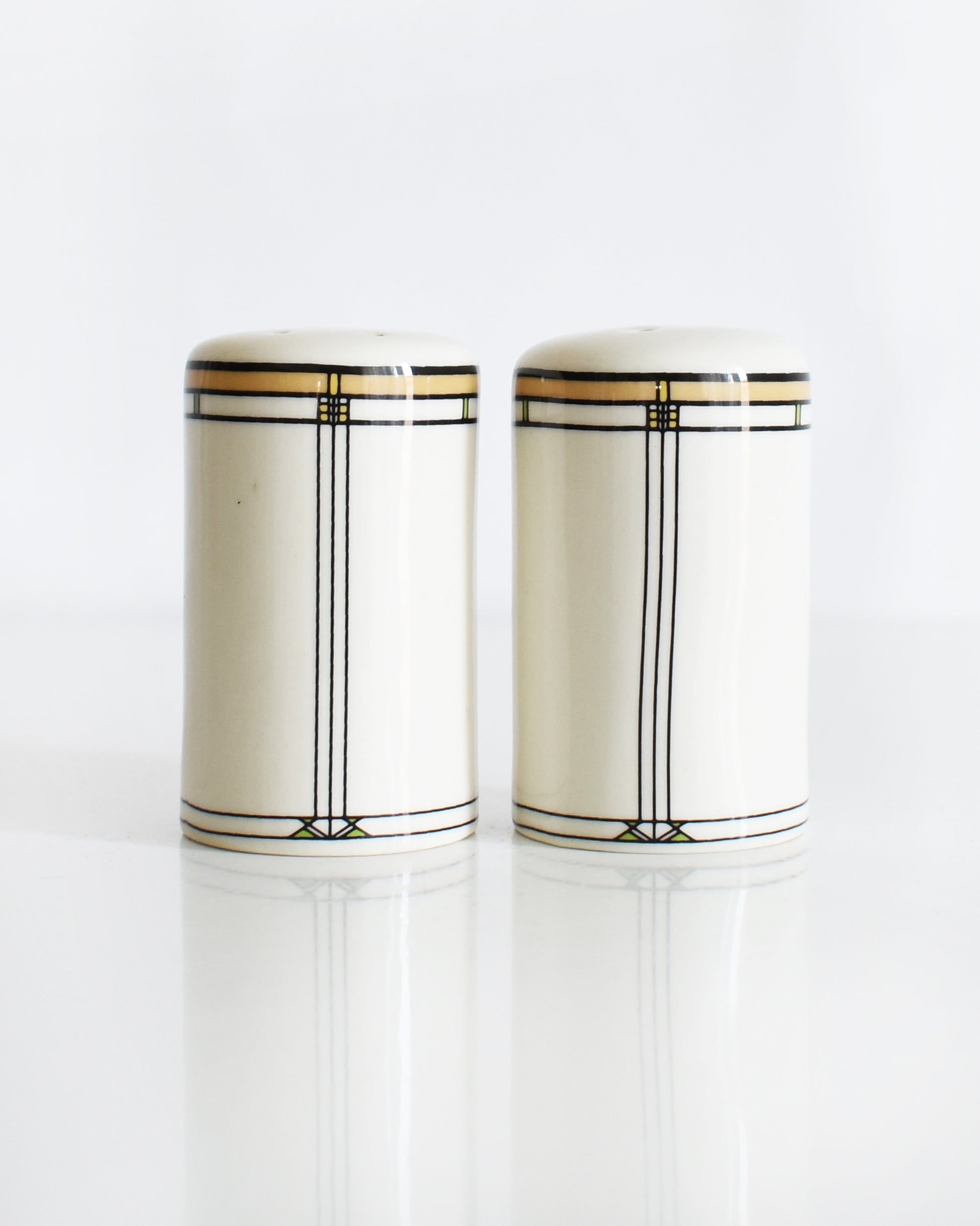 a set of ceramic Frank Lloyd Wright Martin House salt and pepper shakers on a white background