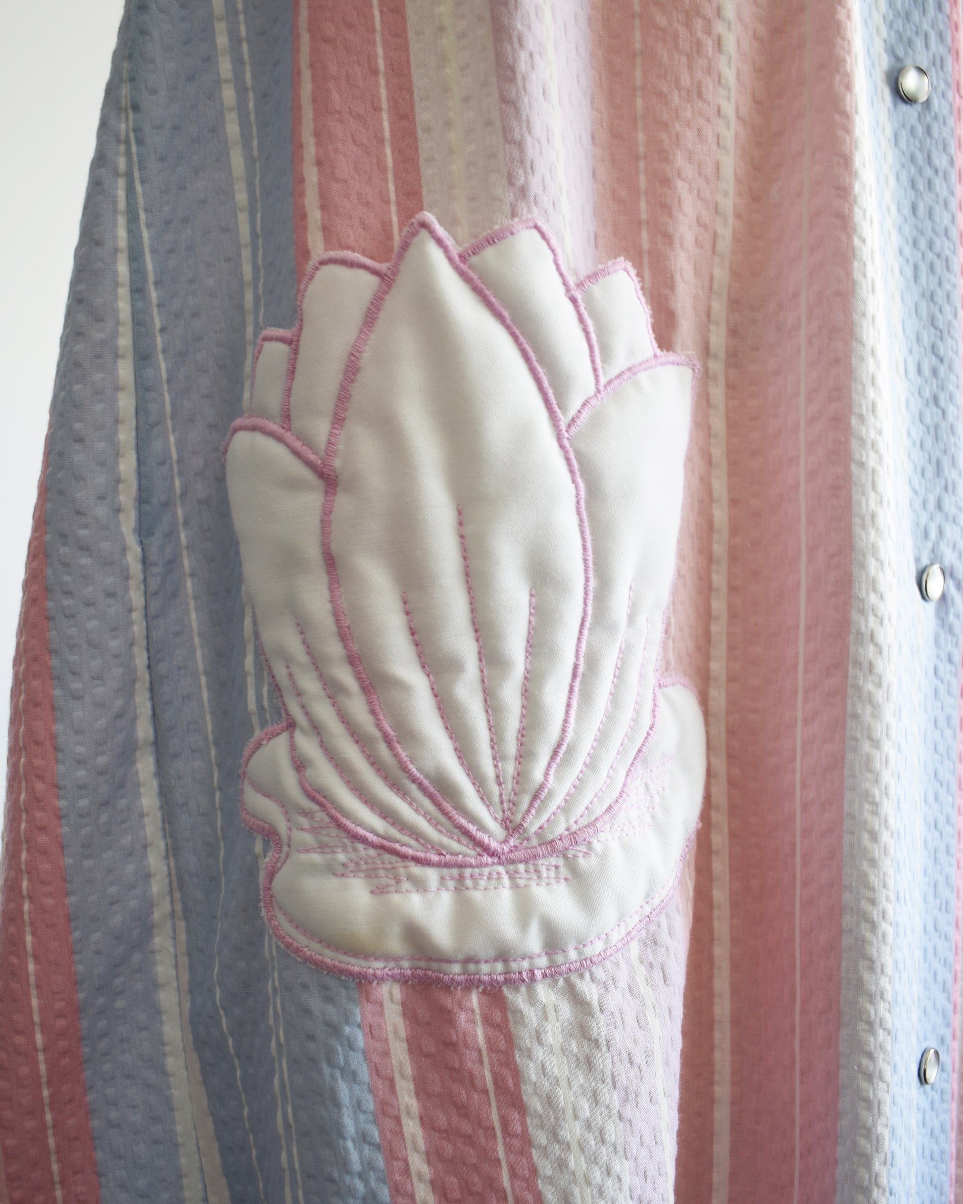 close up of the white lily pad appliqe pocket