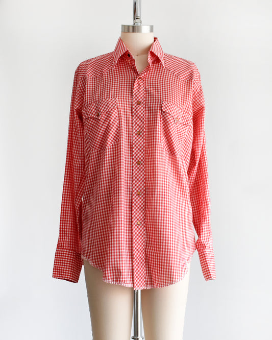 a vintage 1970s red and white gingham shirt on a mannequin against a white background