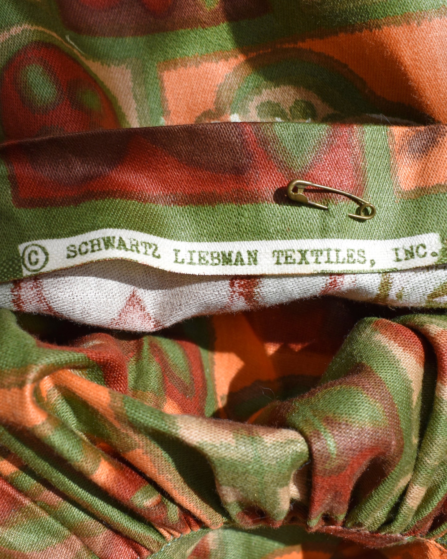 Close-up of fabric with a label for Schwartz Liebman Textiles, Inc.