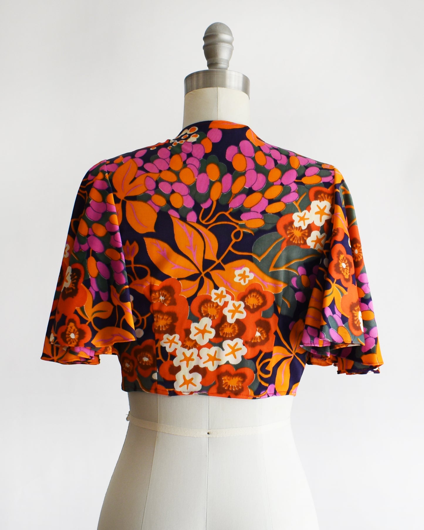 back view of a vintage 70s floral wrap blouse