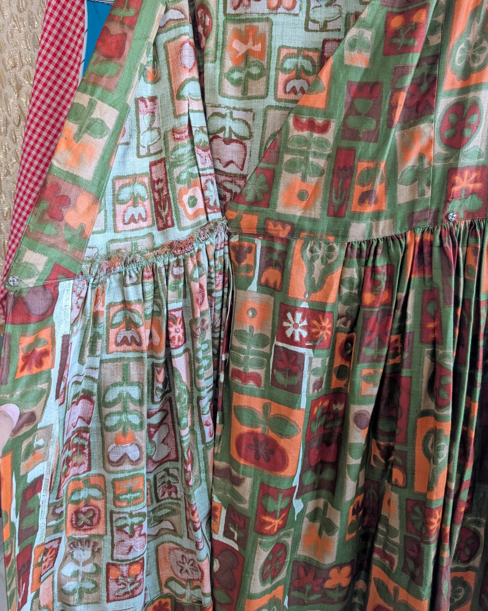 A photo of the dress opening, showing the  metal snaps on the inside waist